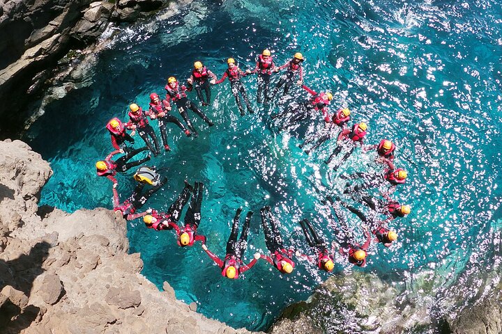 Canyoning in Madeira — descending a waterfall with rope